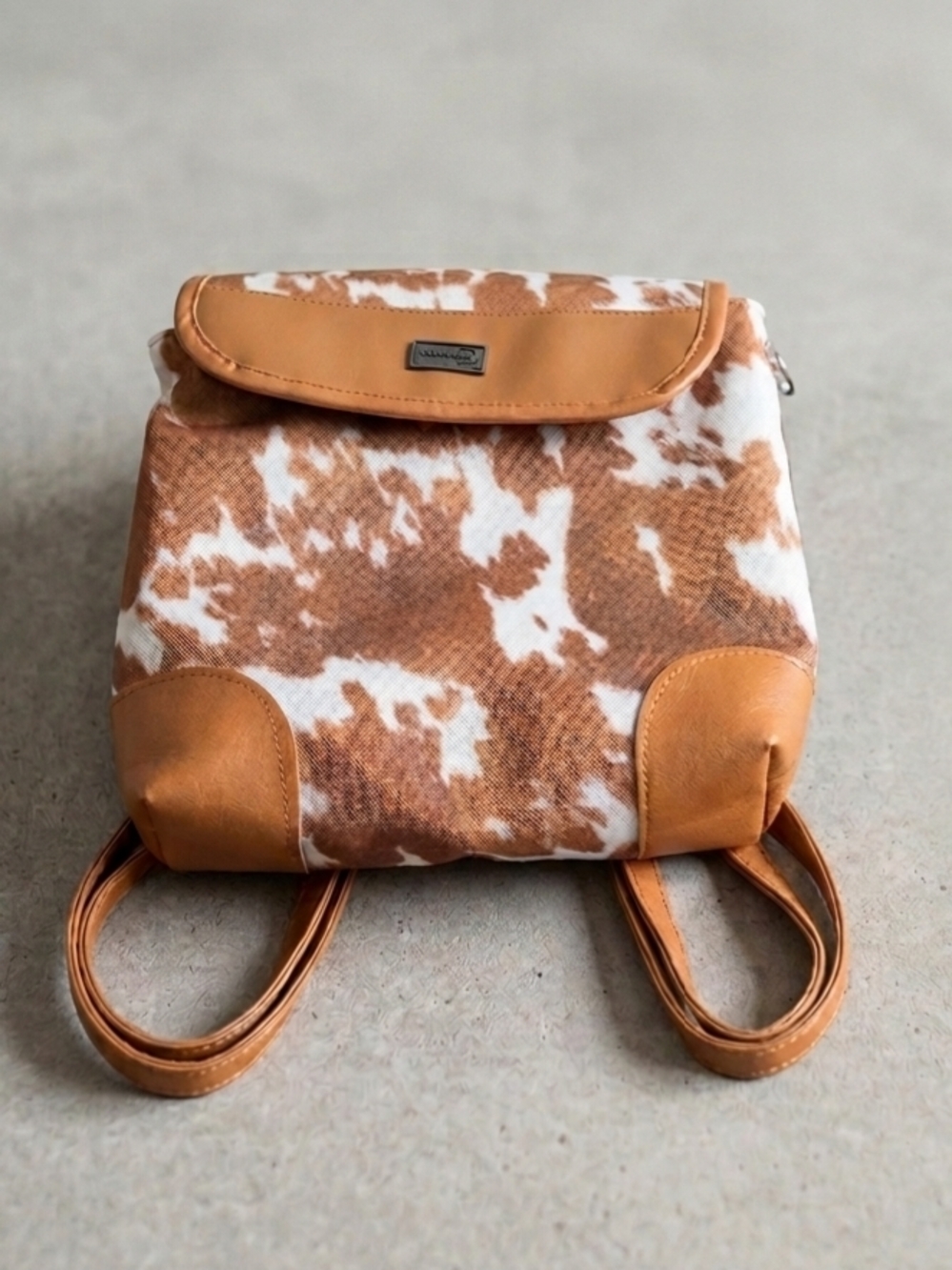 Backpack with cowhide print and vinyl details - Brown